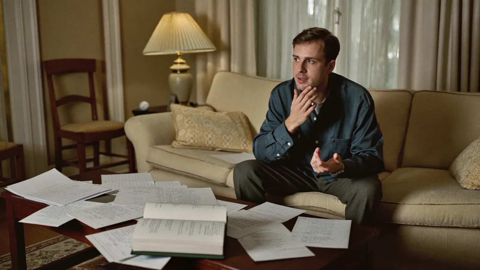 A candidate rehearsing interview answers with handwritten notes spread on a table